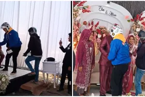 Momen kurir antar paket di tengah resepsi nikahan, disambut hangat mempelai hingga diajak foto bareng